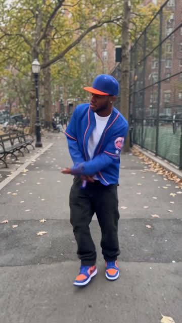 Point & stroll — Arm out, pointing past the camera, still walking the line.